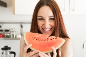 Woman eating watermelon
