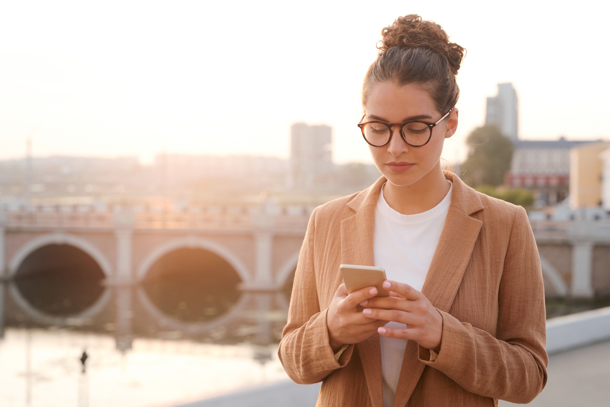 Young businesswoman checking messengers